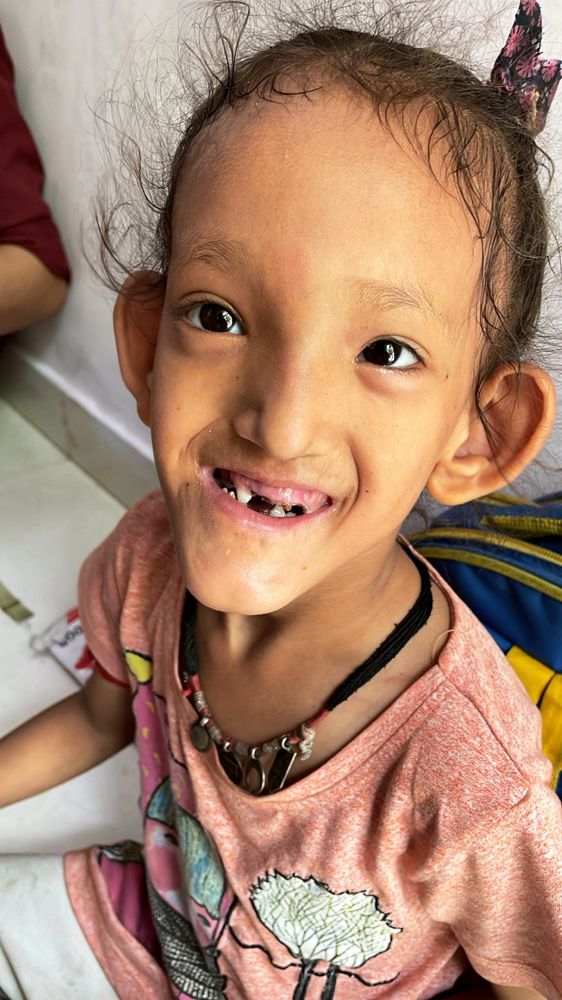 A child from one of our weekend classrooms, smiling